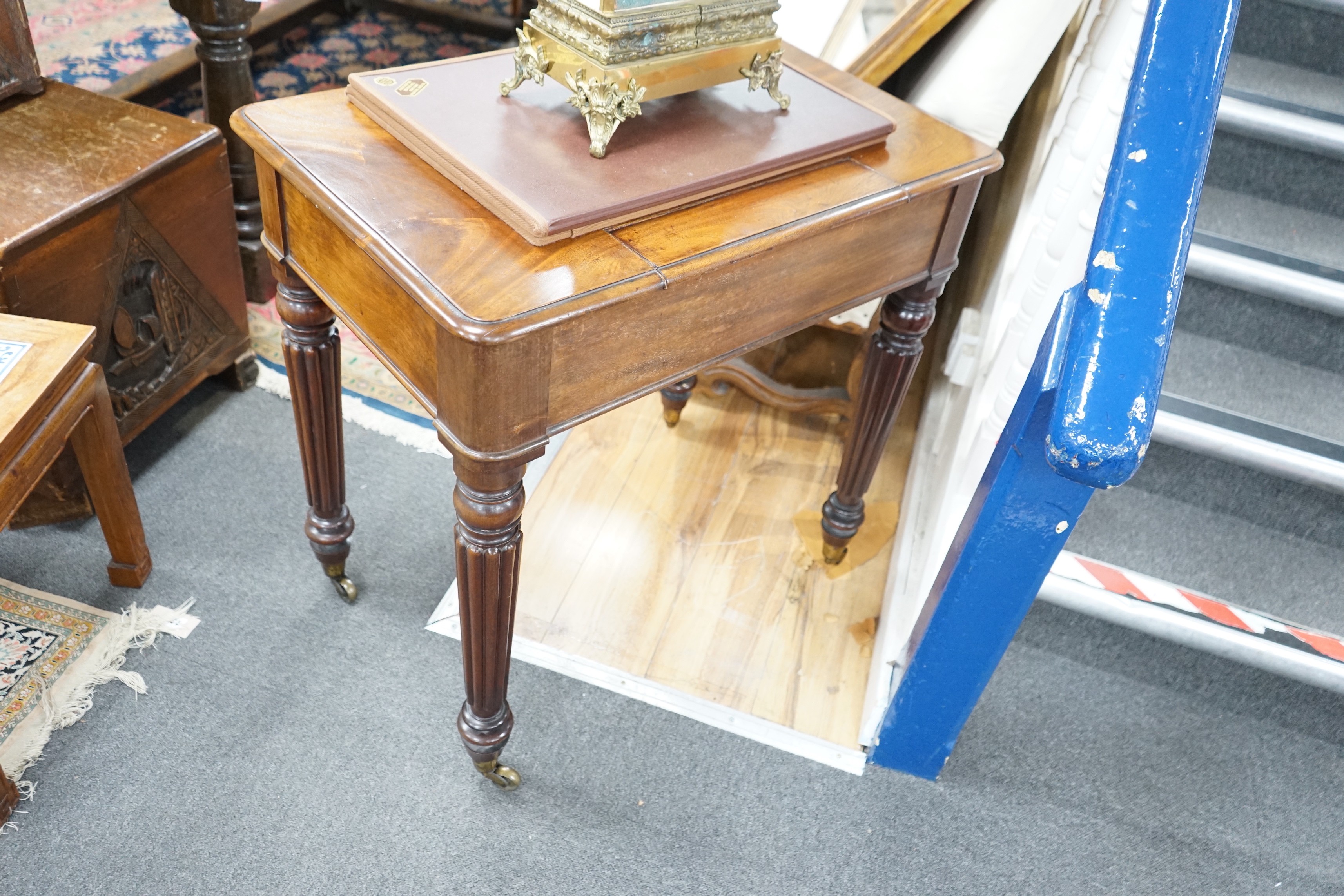 An early Victorian mahogany writing table stamped M Willson, 68 Great Queen Street, width 76cm, depth 48cm, height 74cm